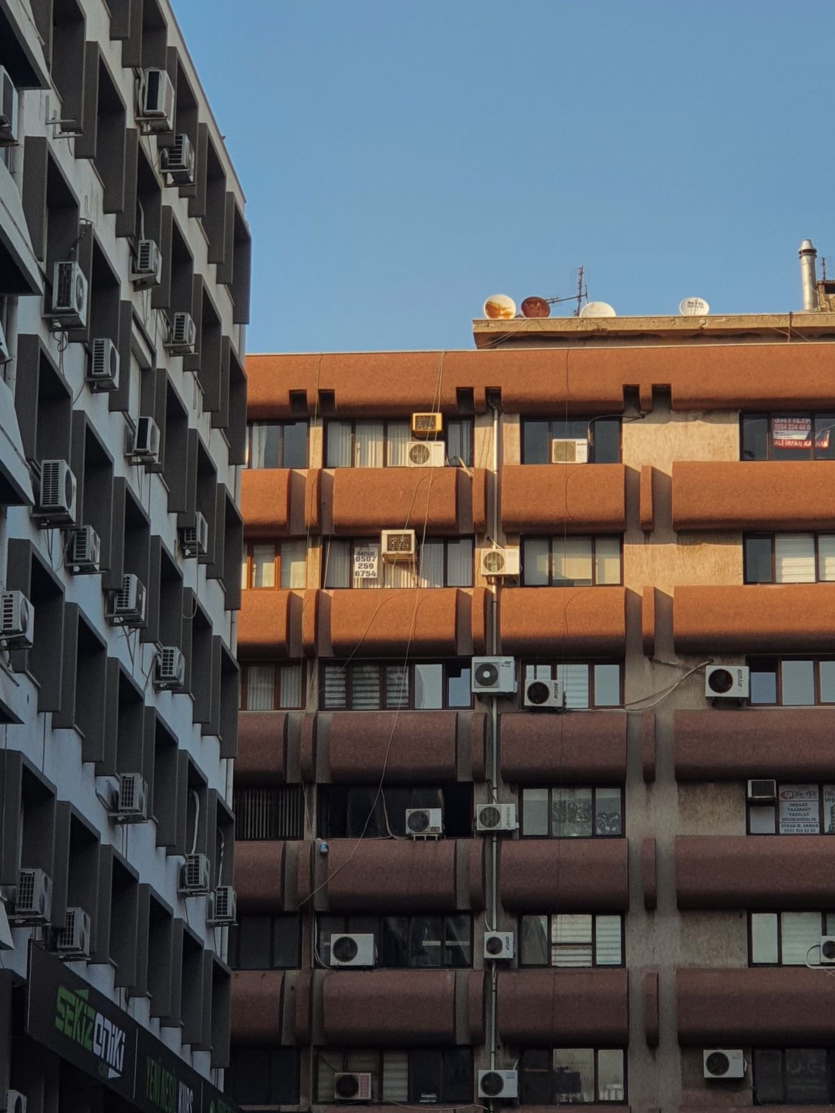 Urban apartment buildings with air conditioning units