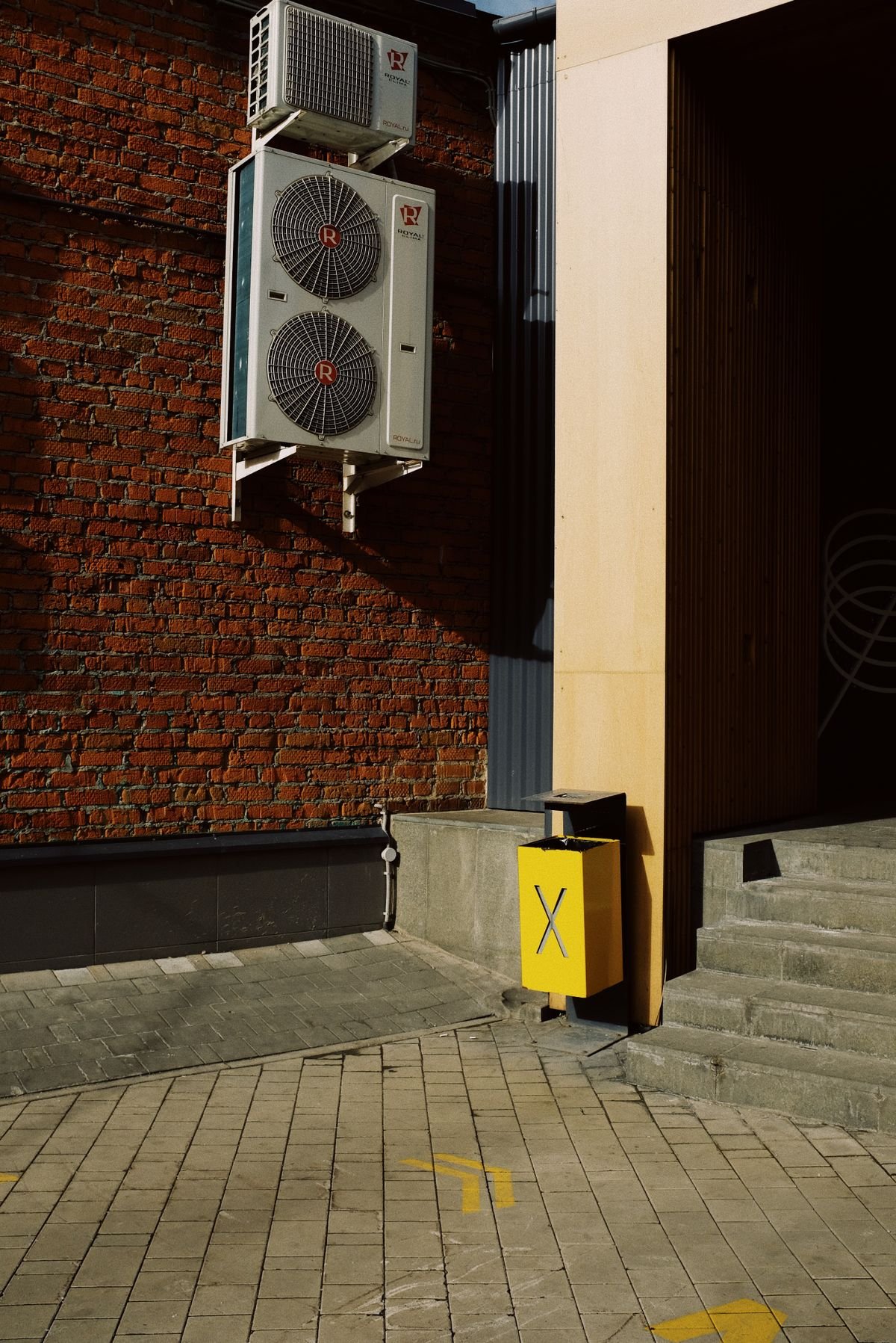HVAC units mounted on a brick wall