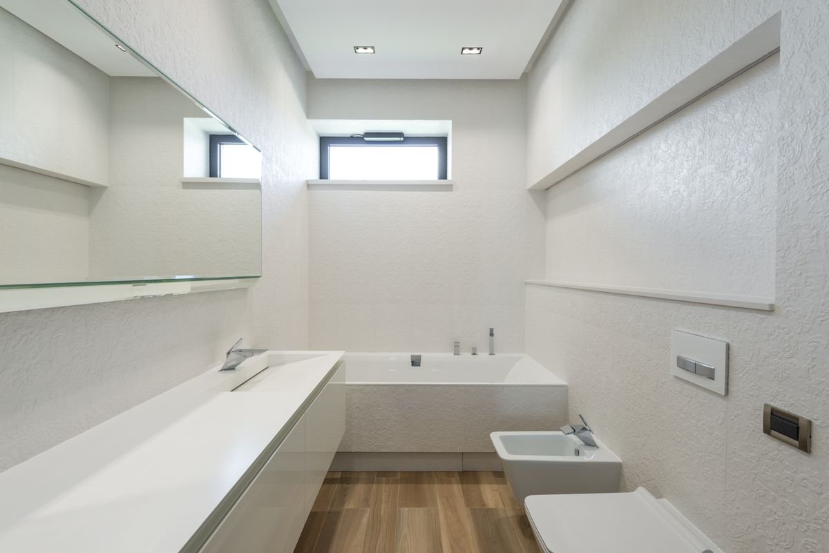 Bathroom shower renovation Dubai white tiles