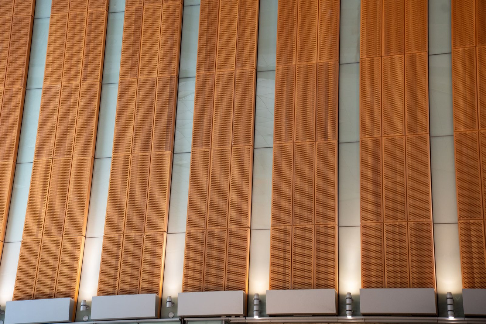 Contemporary facade in Doha with vertical copper-toned panels and a modern architectural design