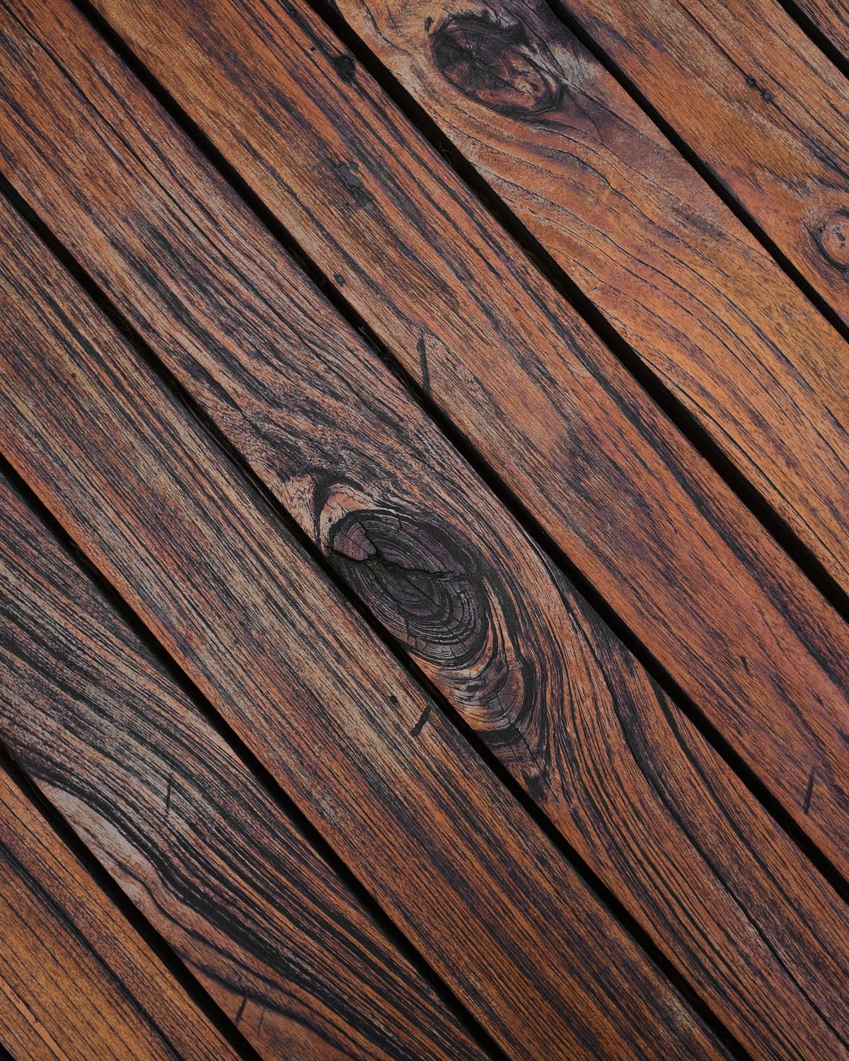 Detailed view of weathered wooden deck planks showing natural grain