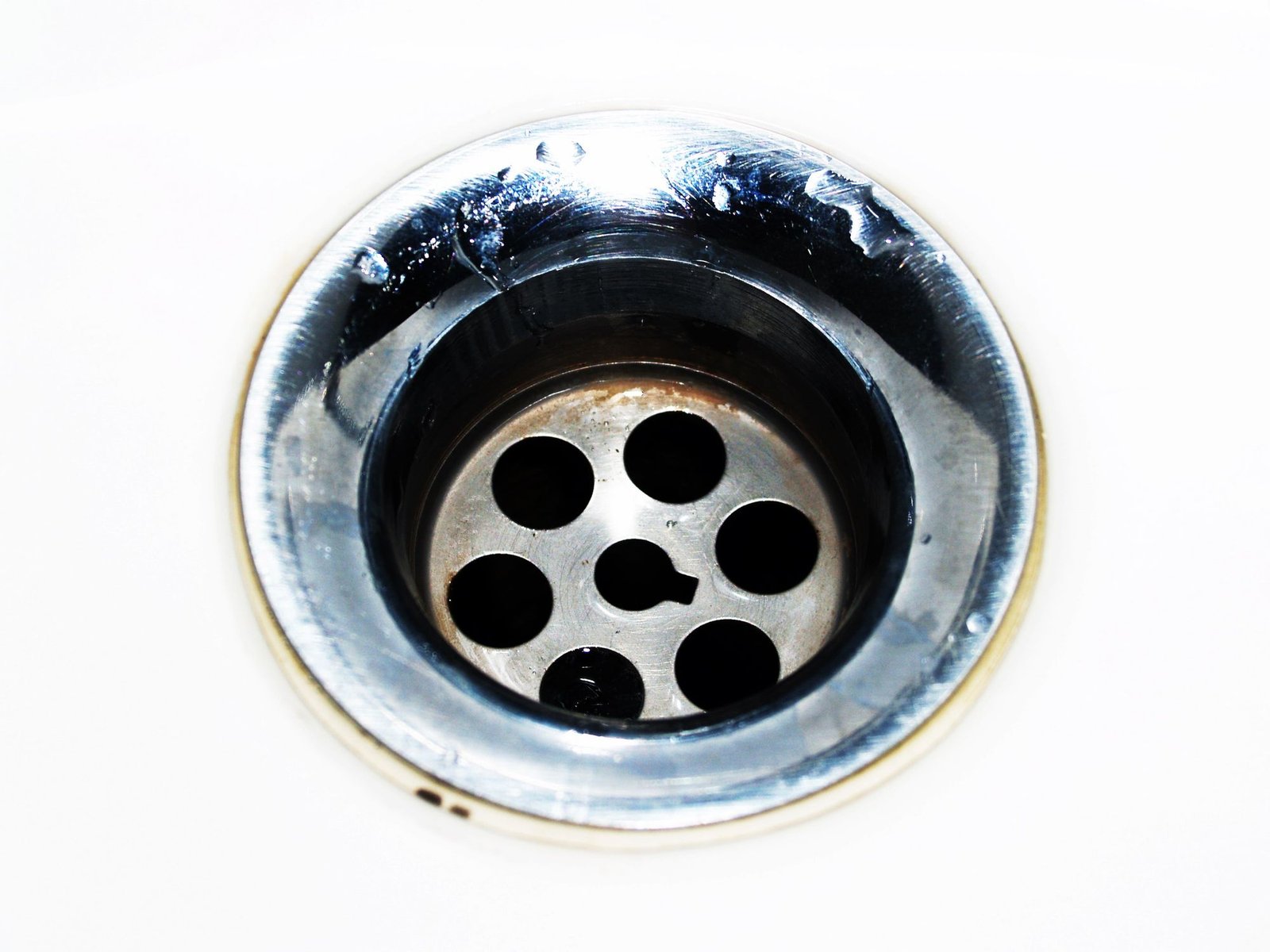 Close-up of a clean stainless steel sink drain