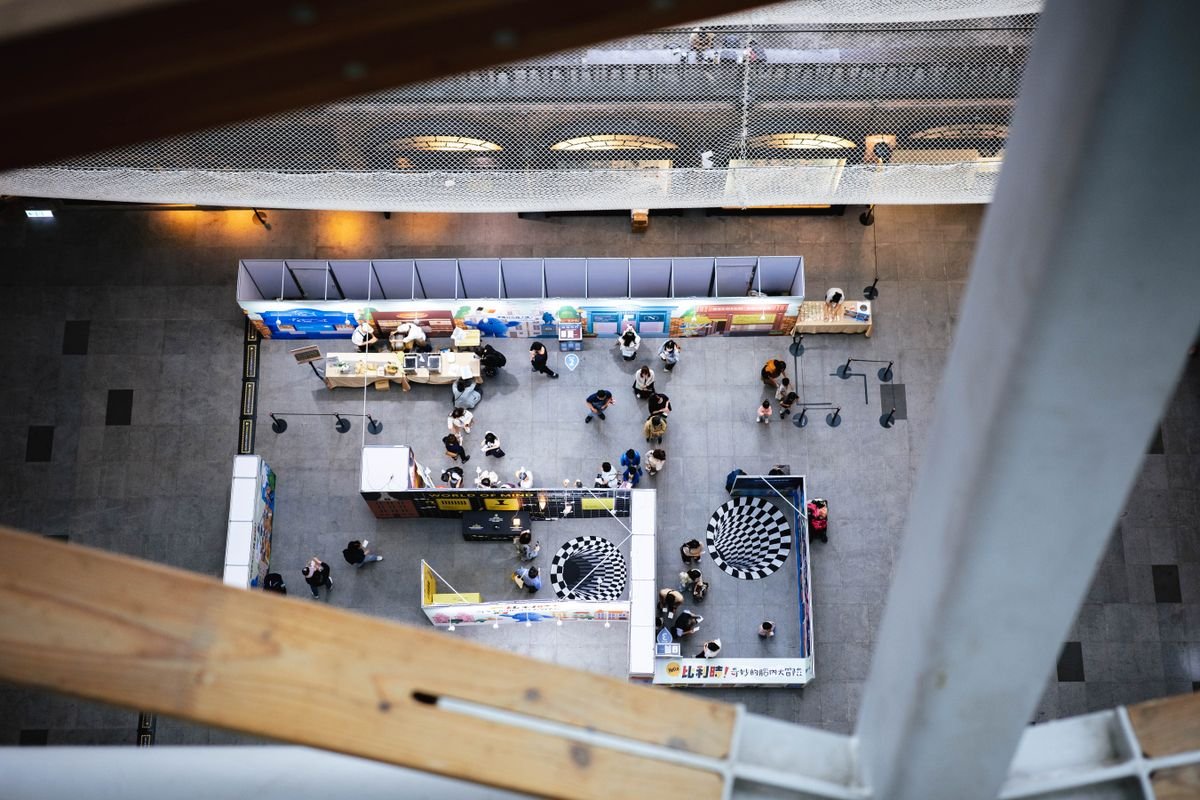 Aerial view of a bustling indoor exhibition space