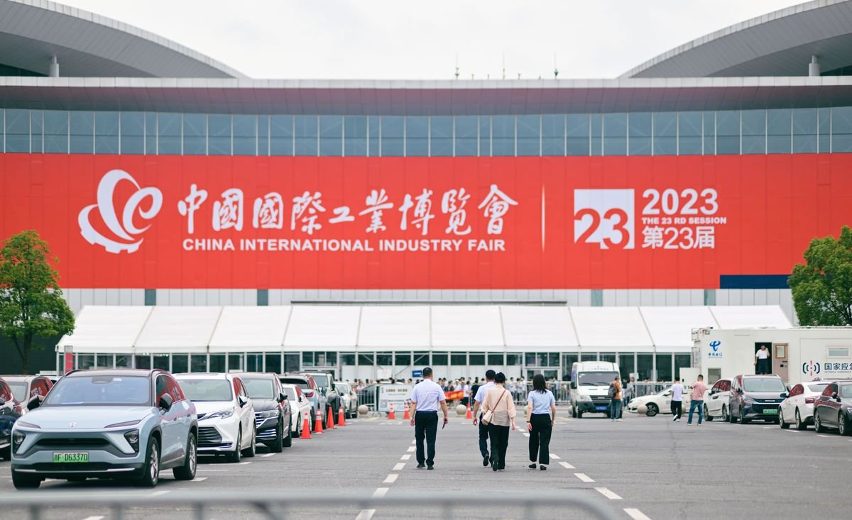 People walking towards a national convention and exhibition center