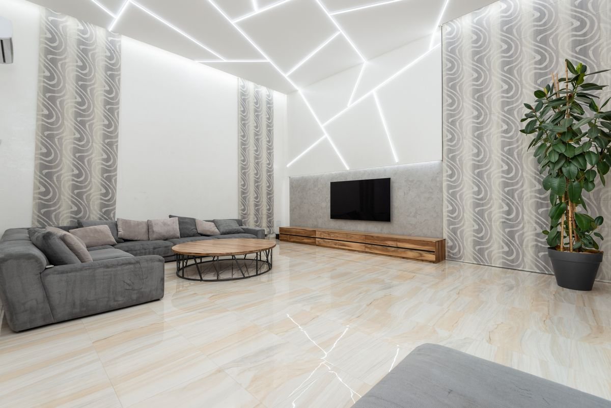 Villa living room ceiling outlined with white LED lines and angular panels