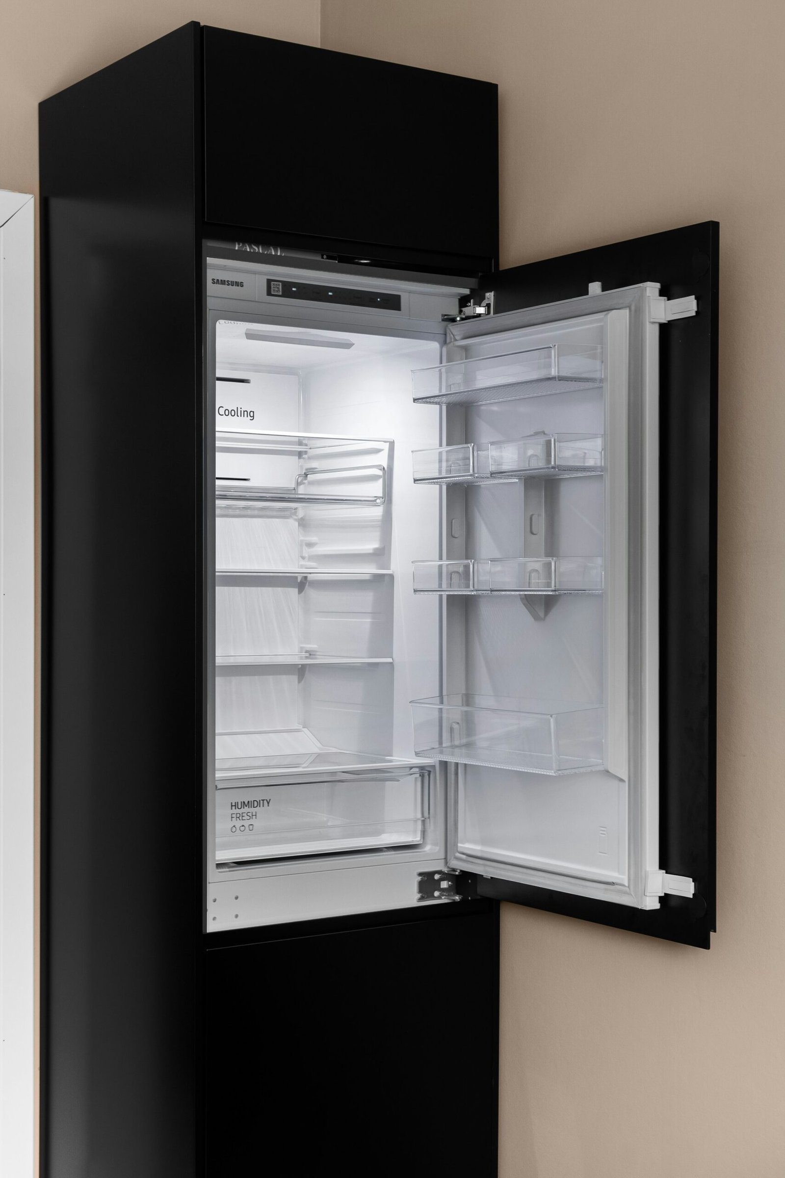 Refrigerator being inspected for a water leak in Dubai