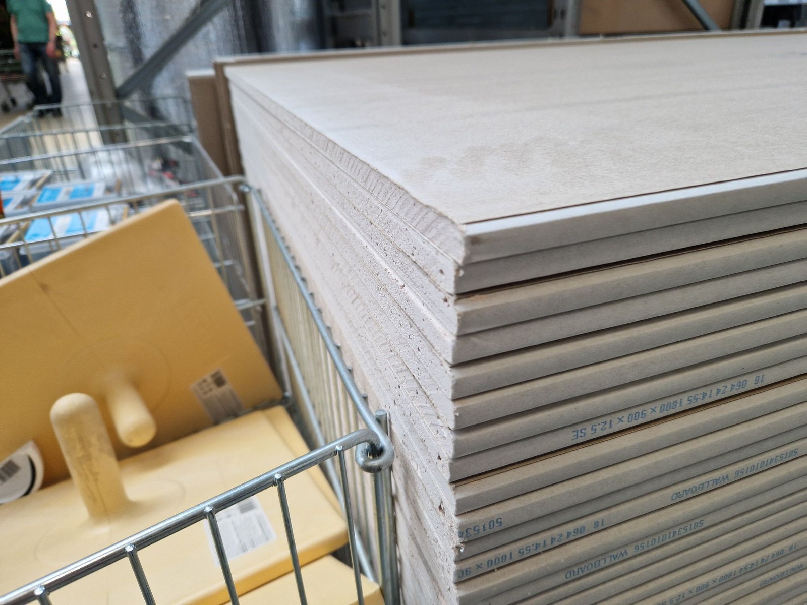 Stack of gypsum board panels in a building materials warehouse