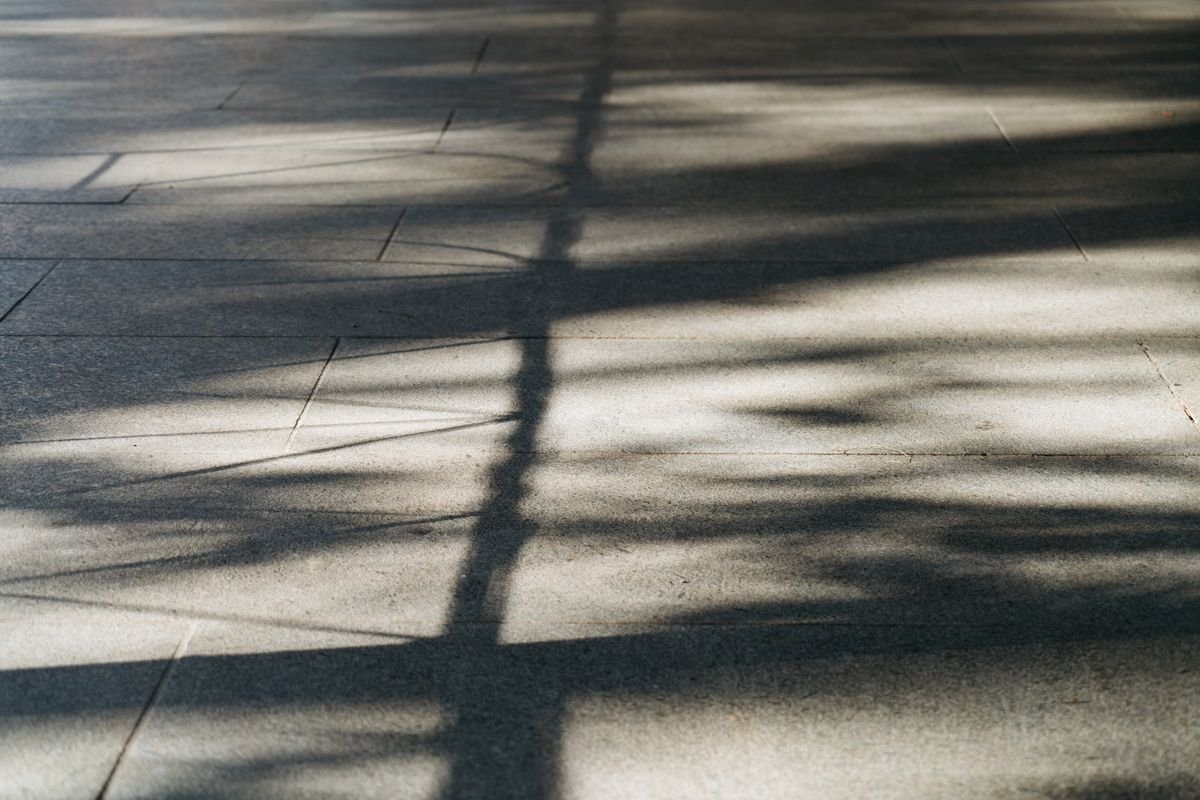 Large flat paved area with shadows falling evenly across the surface