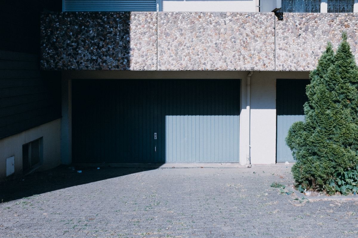 House garage with interlock paver tiles laid in front of the entrance