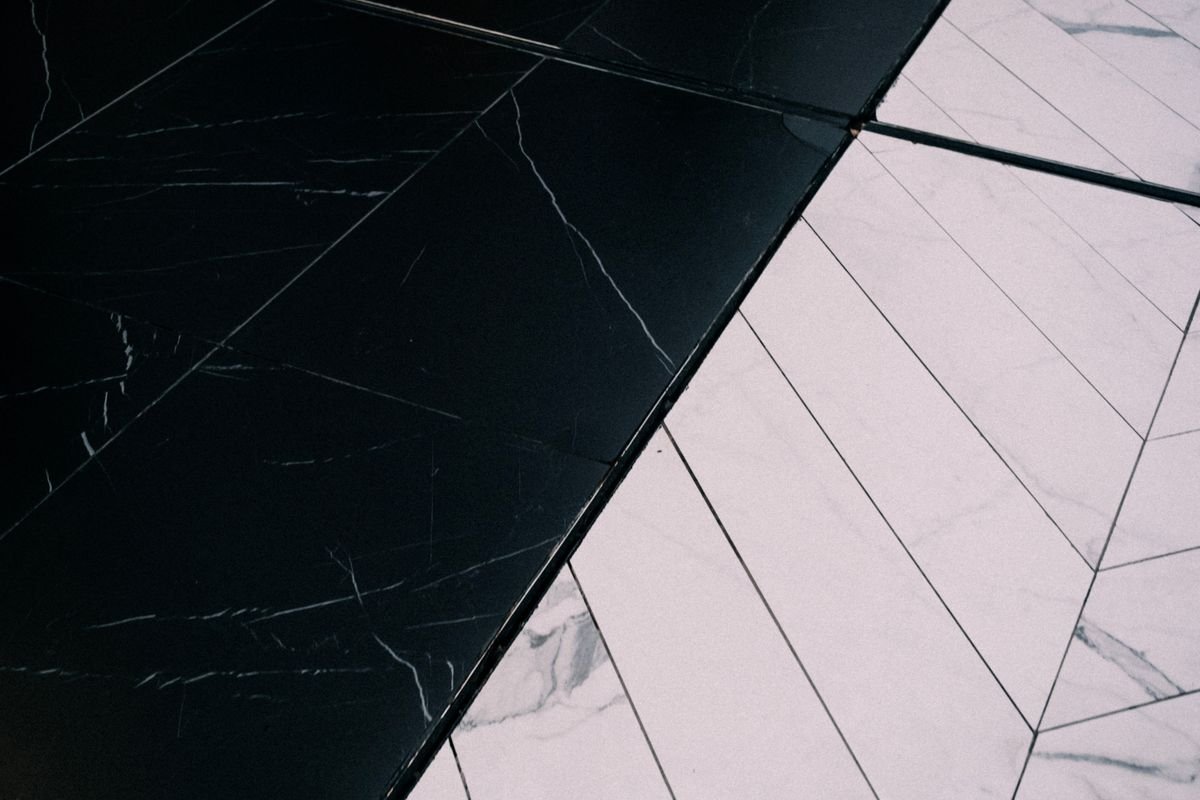 Black and white marble tiles with geometric pattern