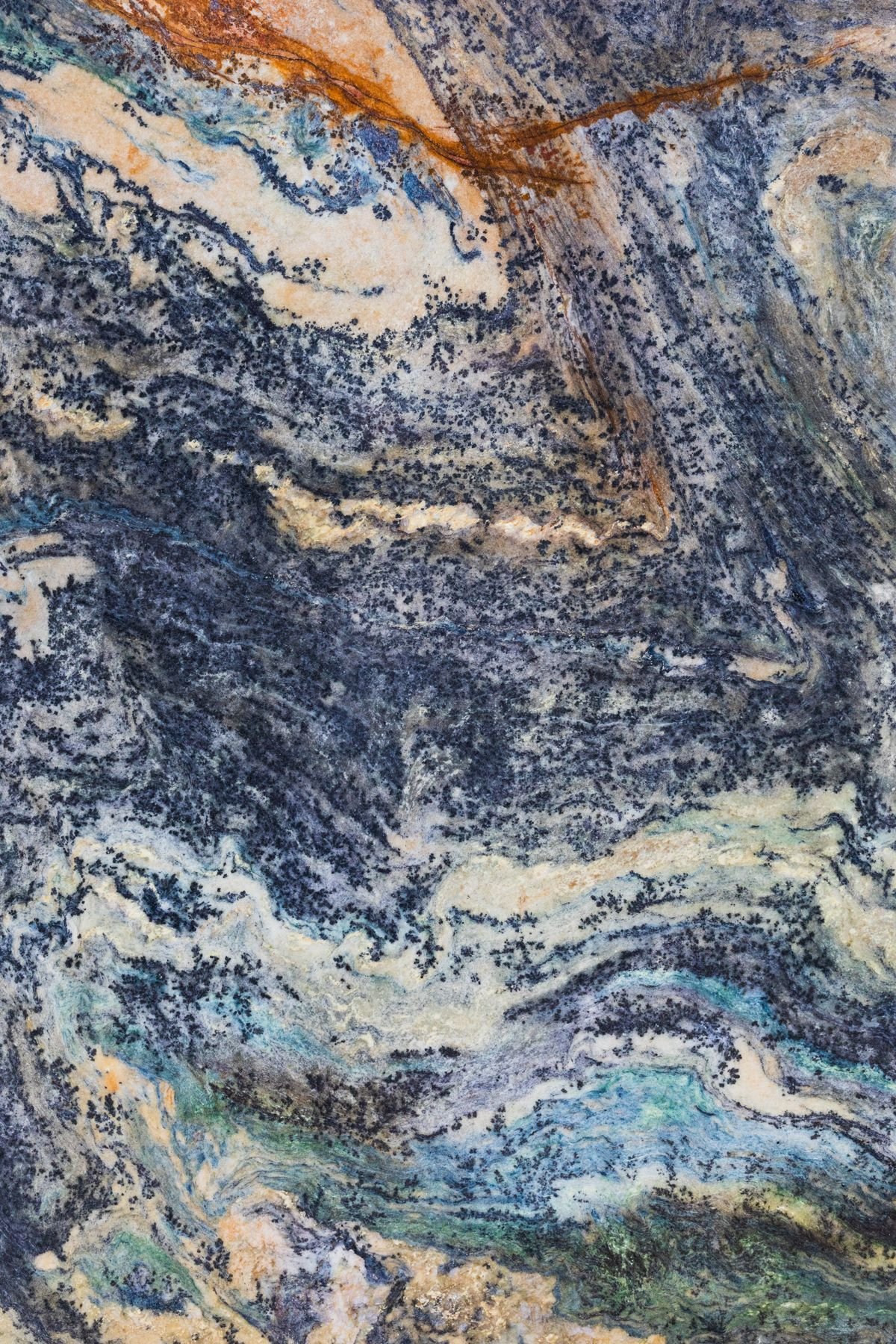 Natural stone slab showing vivid blue and orange mineral patterns