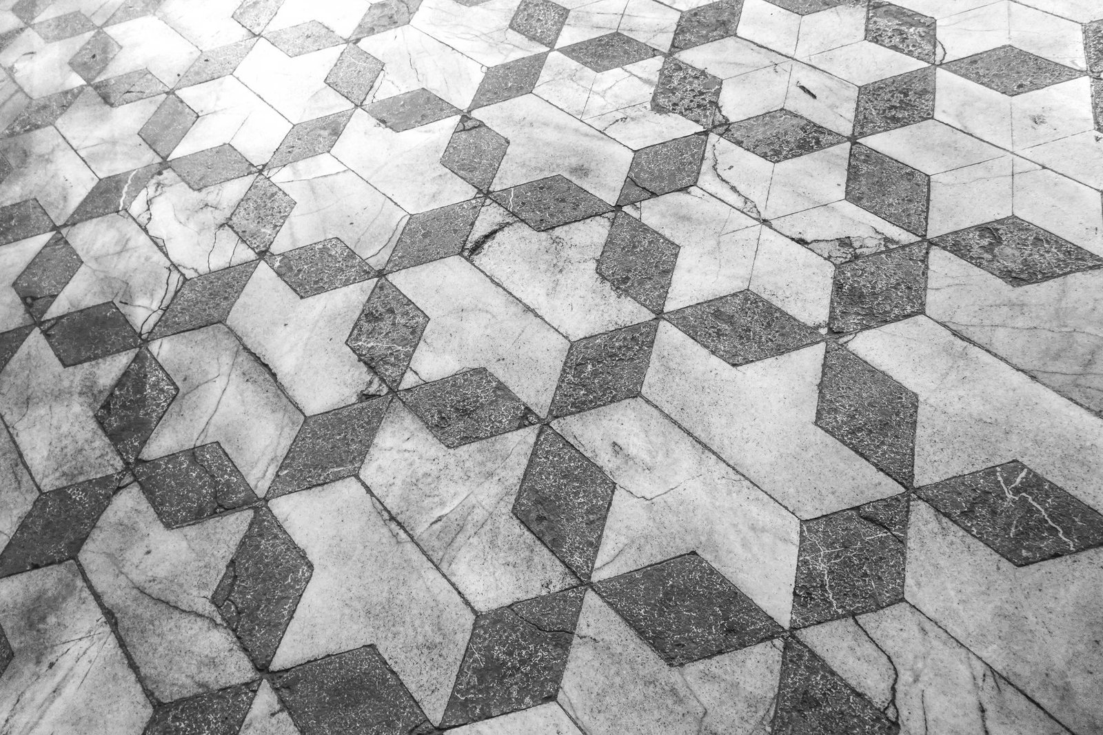 Polished marble floor tiles forming a striking geometric star pattern