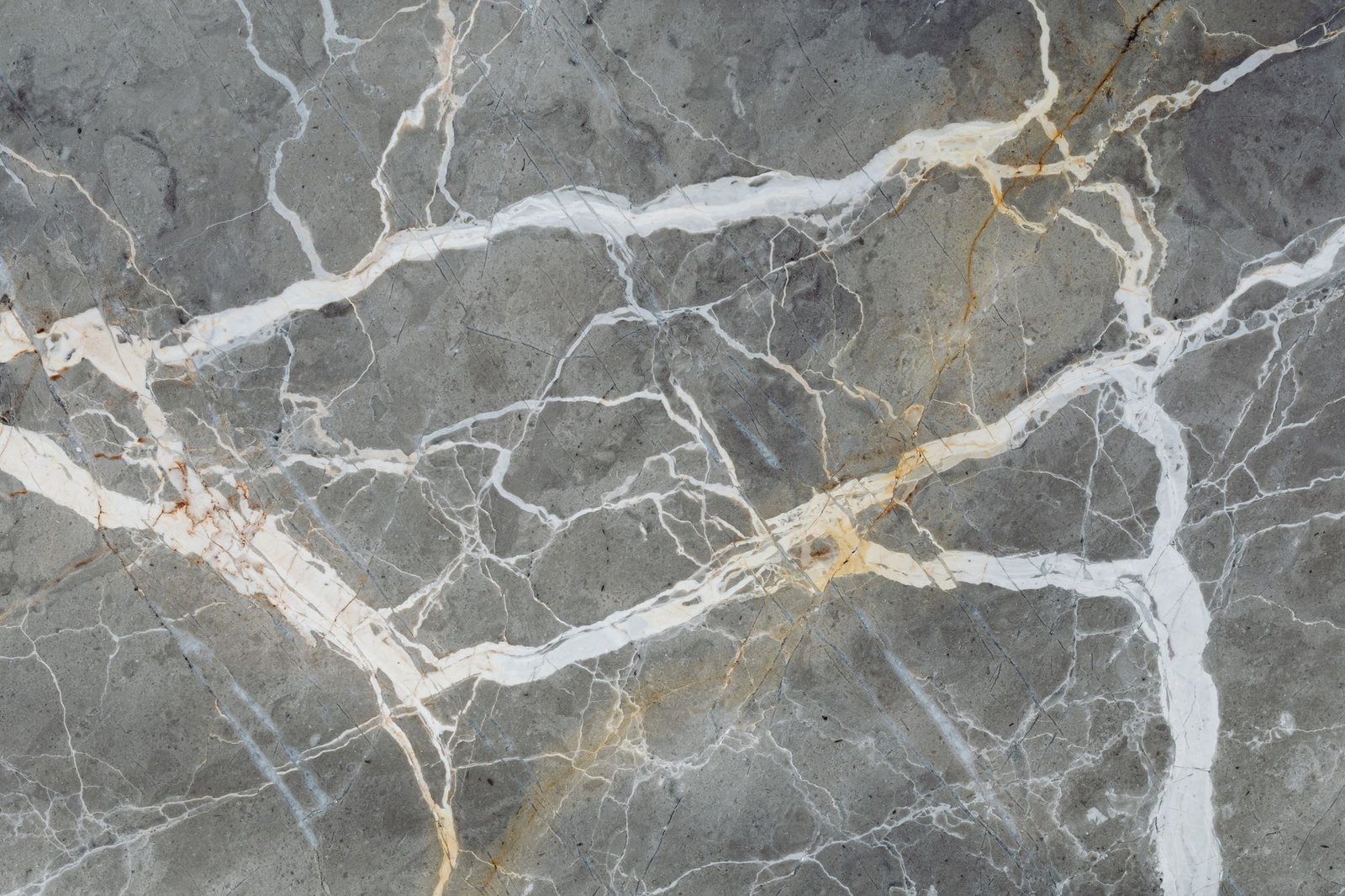 Dramatic grey marble slab with bold white and gold natural veining