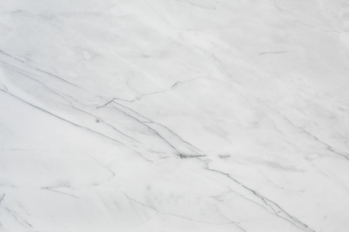 Clean white marble surface with subtle natural veining