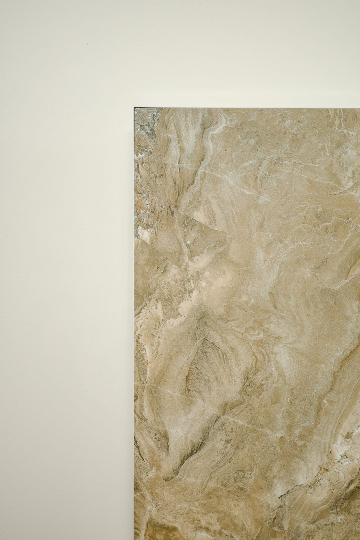 Close-up of a beige marbled natural stone tile