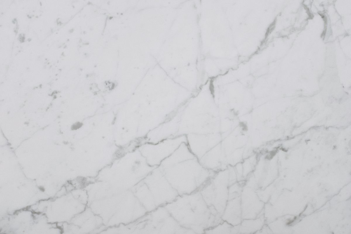 White marble countertop surface with natural veining and texture
