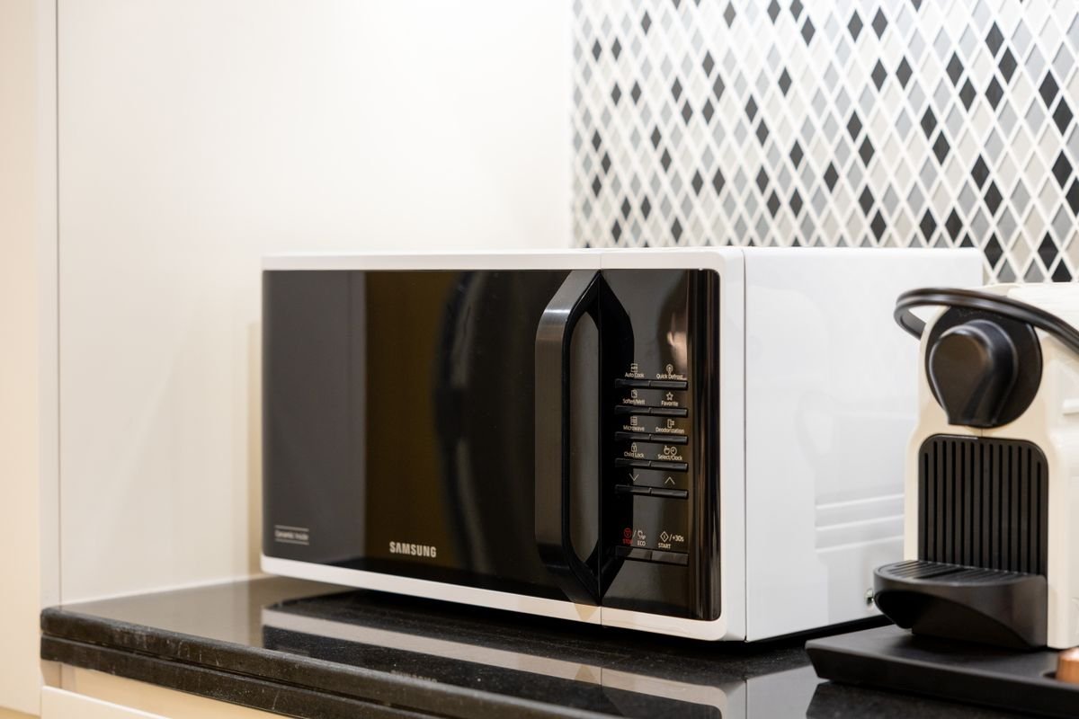 Black microwave on a kitchen counter