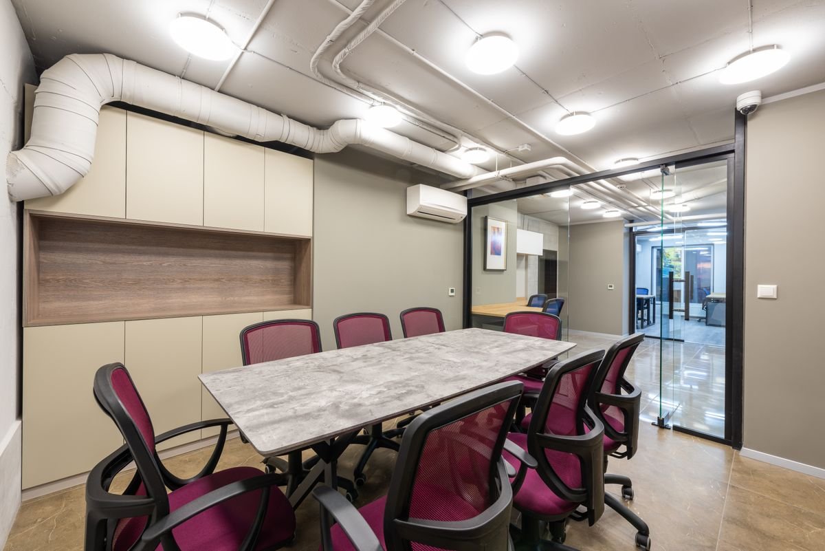 Spacious boardroom with modern decor and glass walls