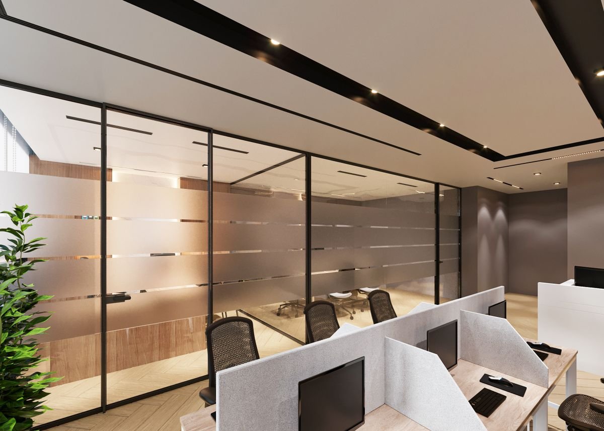 Open office with cubicles divided by large glass partitions
