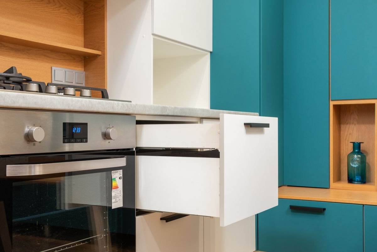 Stainless steel electric oven built into kitchen cabinetry