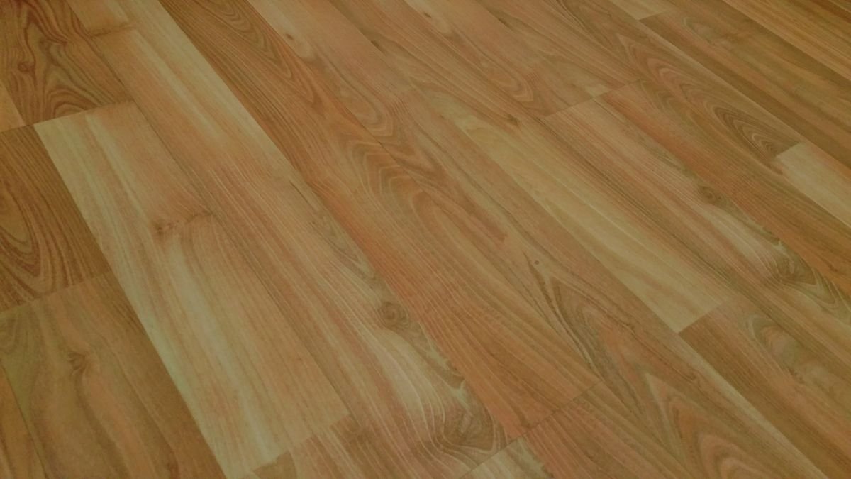 Golden-toned wood-look planks laid on a diagonal