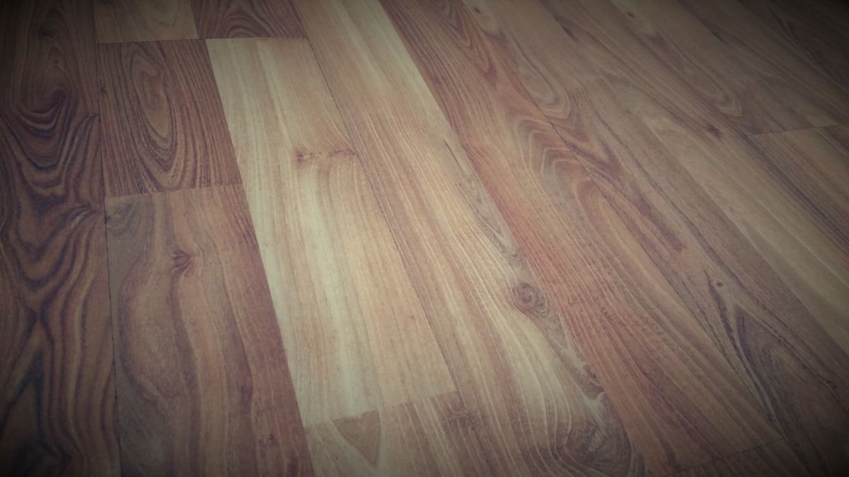 Dark walnut-toned wood-look planks with visible grain