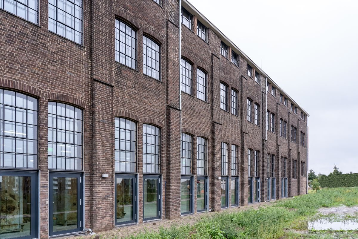 Modern brick building with large windows in a contemporary post-industrial style