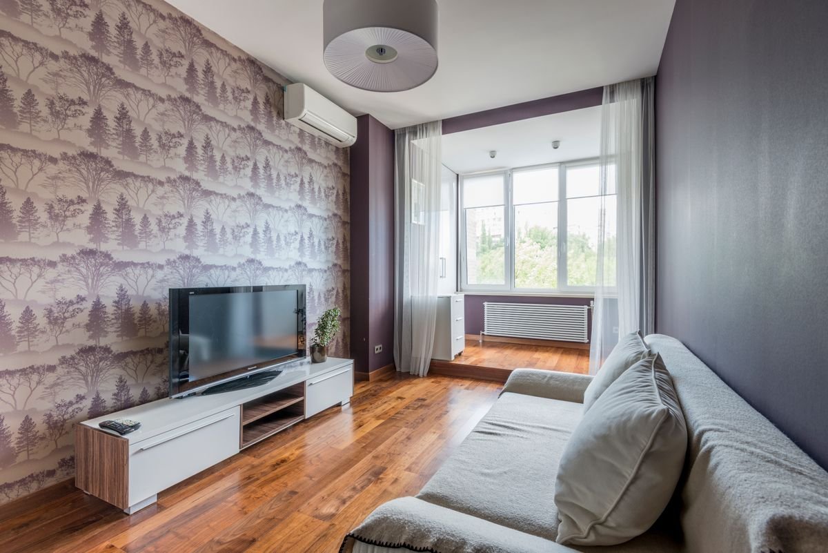 Contemporary living room with decorative wallpaper accent wall