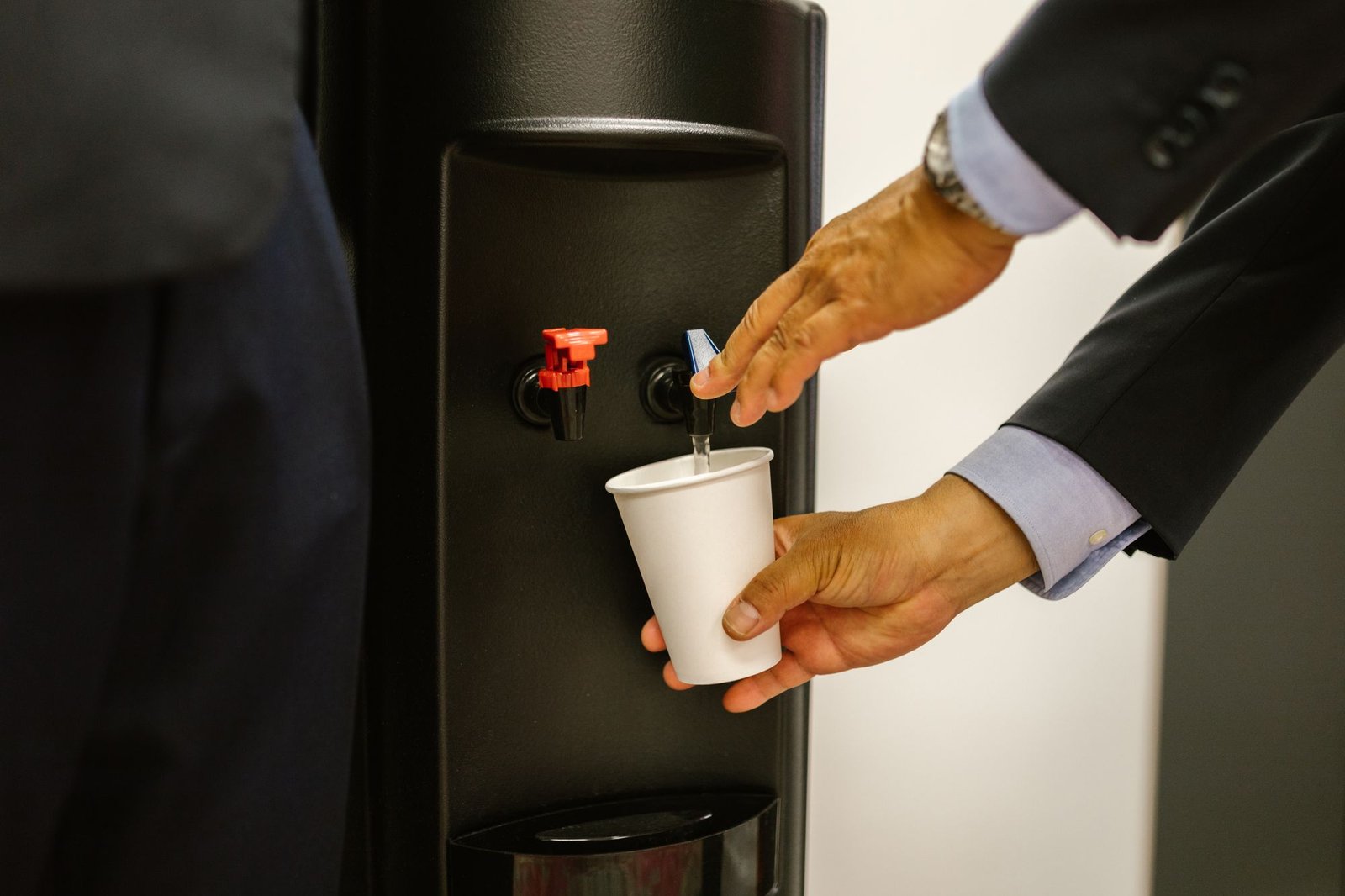Water dispenser in use in a modern office
