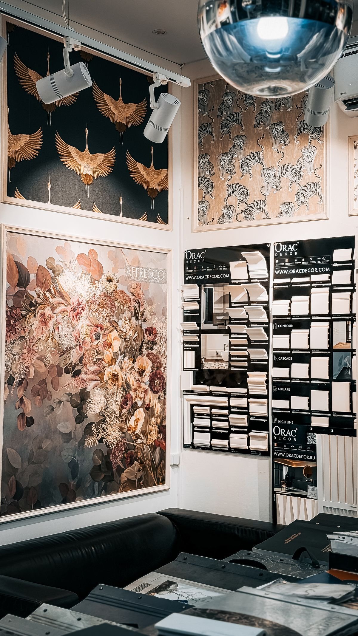 Large-format wallpaper panels with floral and animal prints on display
