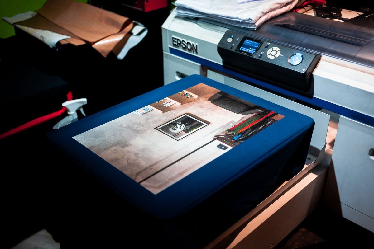 Wide-format printer producing a custom design in a print studio